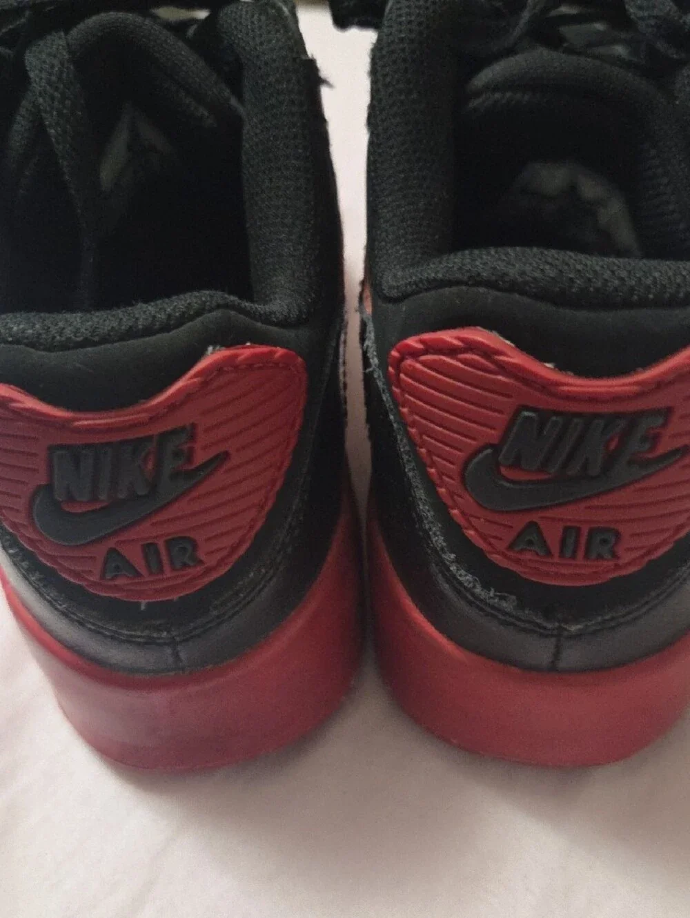 Nike Kids Black Sneakers with Red Accents